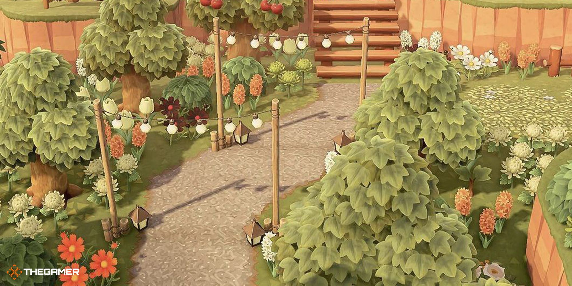 Using string lights and trees to guide the way to a staircase at the entrance of and island in Animal Crossing: New Horizons.