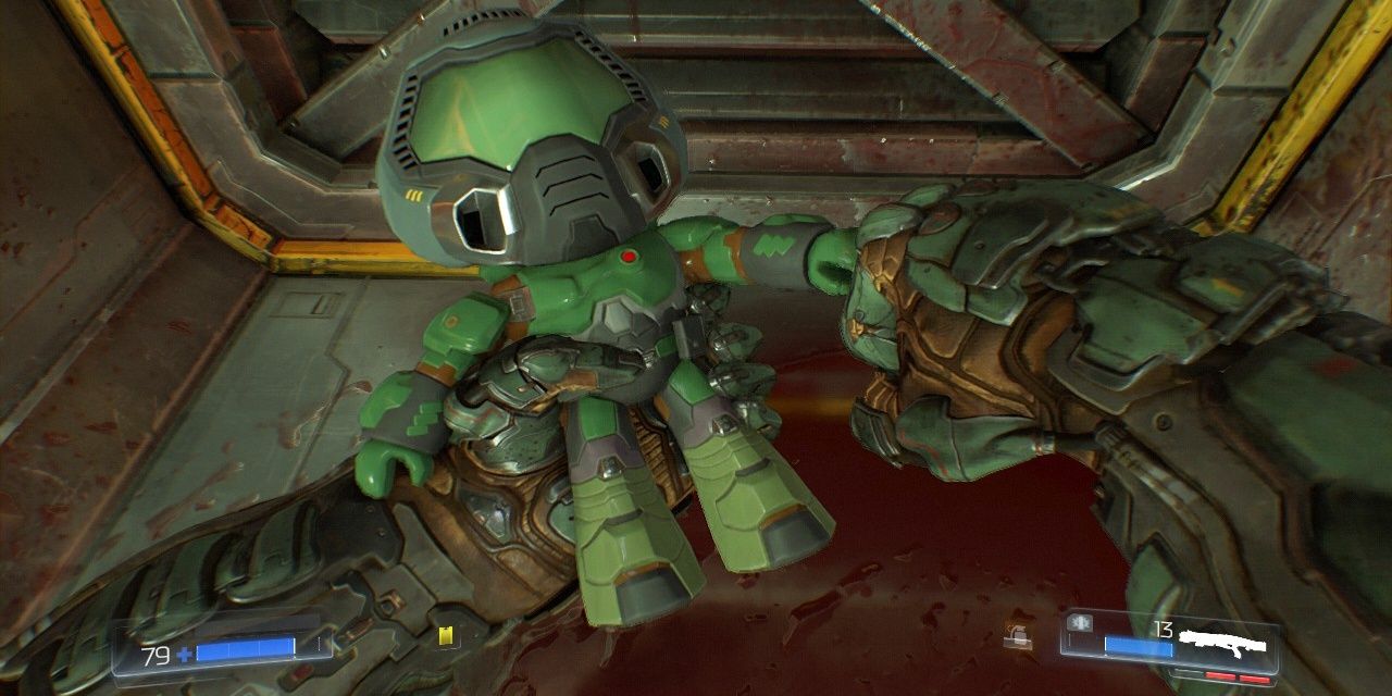 The Doomguy fist-bumping the mini Doomguy action figure