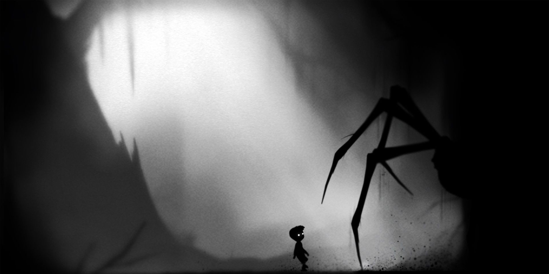 Boy in Limbo standing before a scary spider in black and white