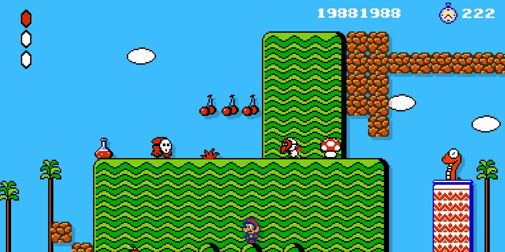 Mario Sits Below A Green Platform With Enemies