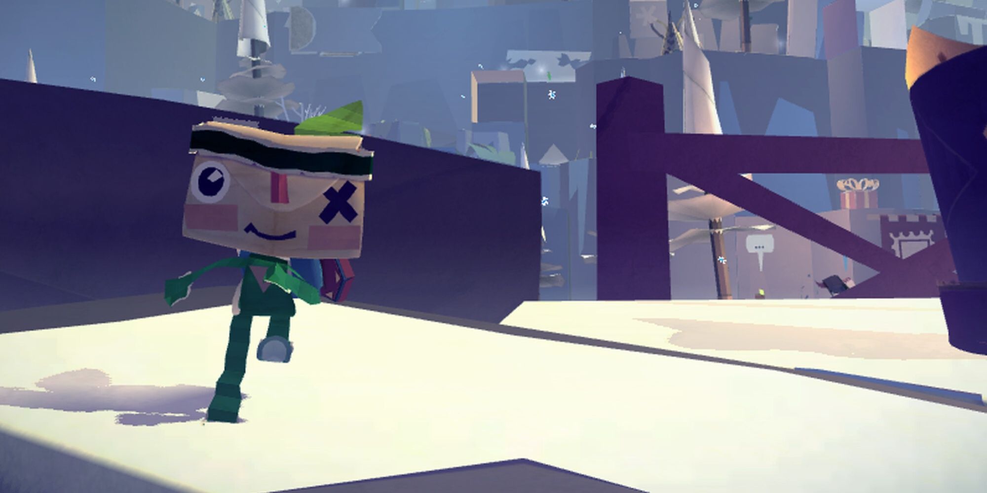 Iota running through a snowy area in Tearaway 