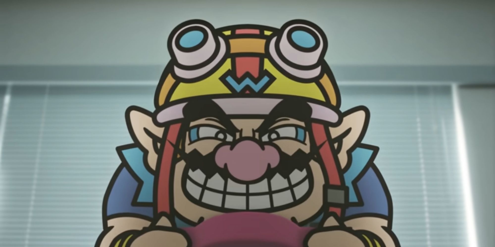 Wario Grimaces While Holding Handheld Console In Dark Office Building