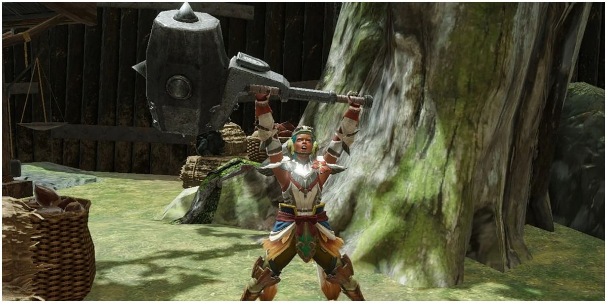 hunter raising large hammer above their head in victory pose