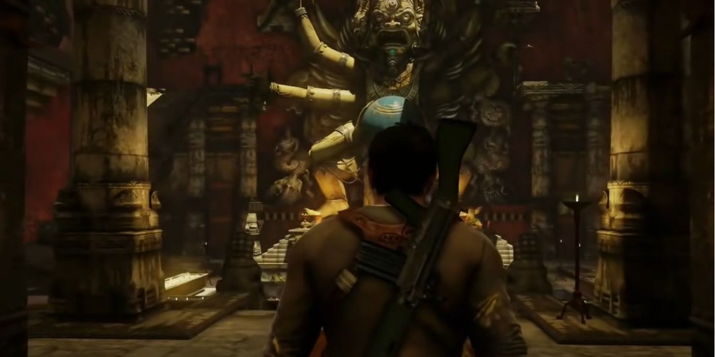 Uncharted 2 Among Thieves Nathan Drake walking into ruins with gun on his back
