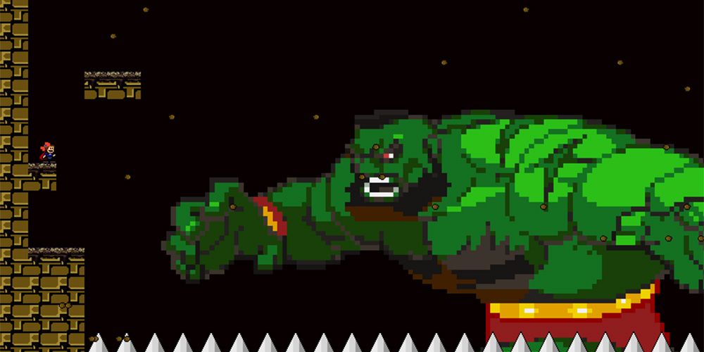 I Wanna Be The Guy Feature showing character battling a giant Zangief-looking creature
