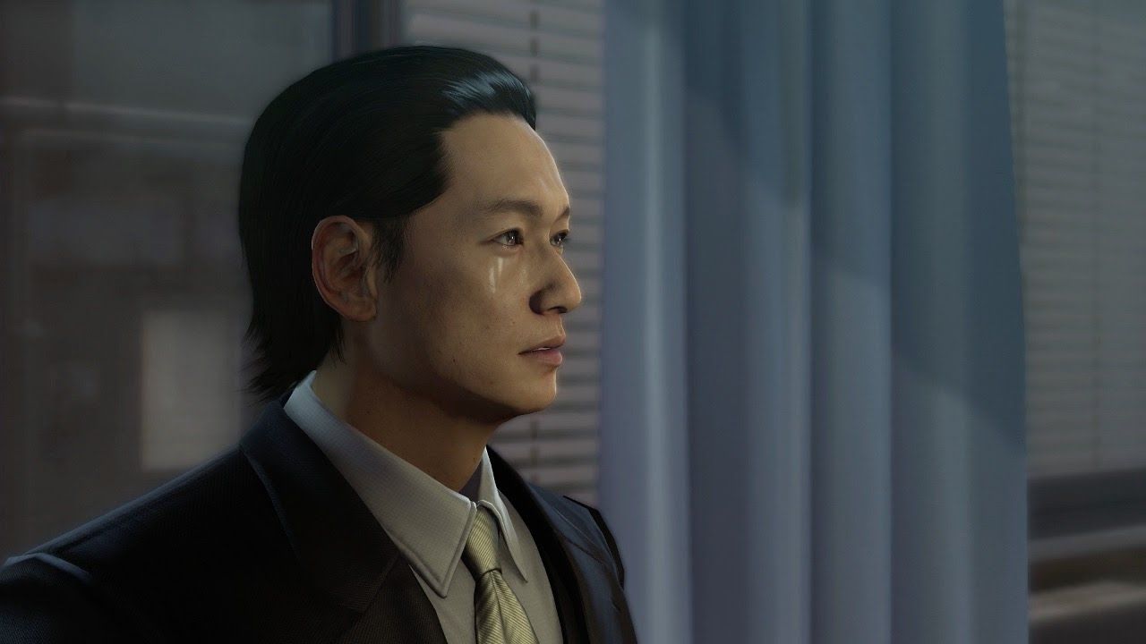 Tachibana crying in front of blue curtains and a window 