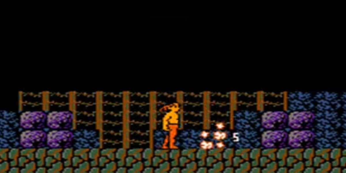 Rambo defeating an enemy in Rambo (NES)