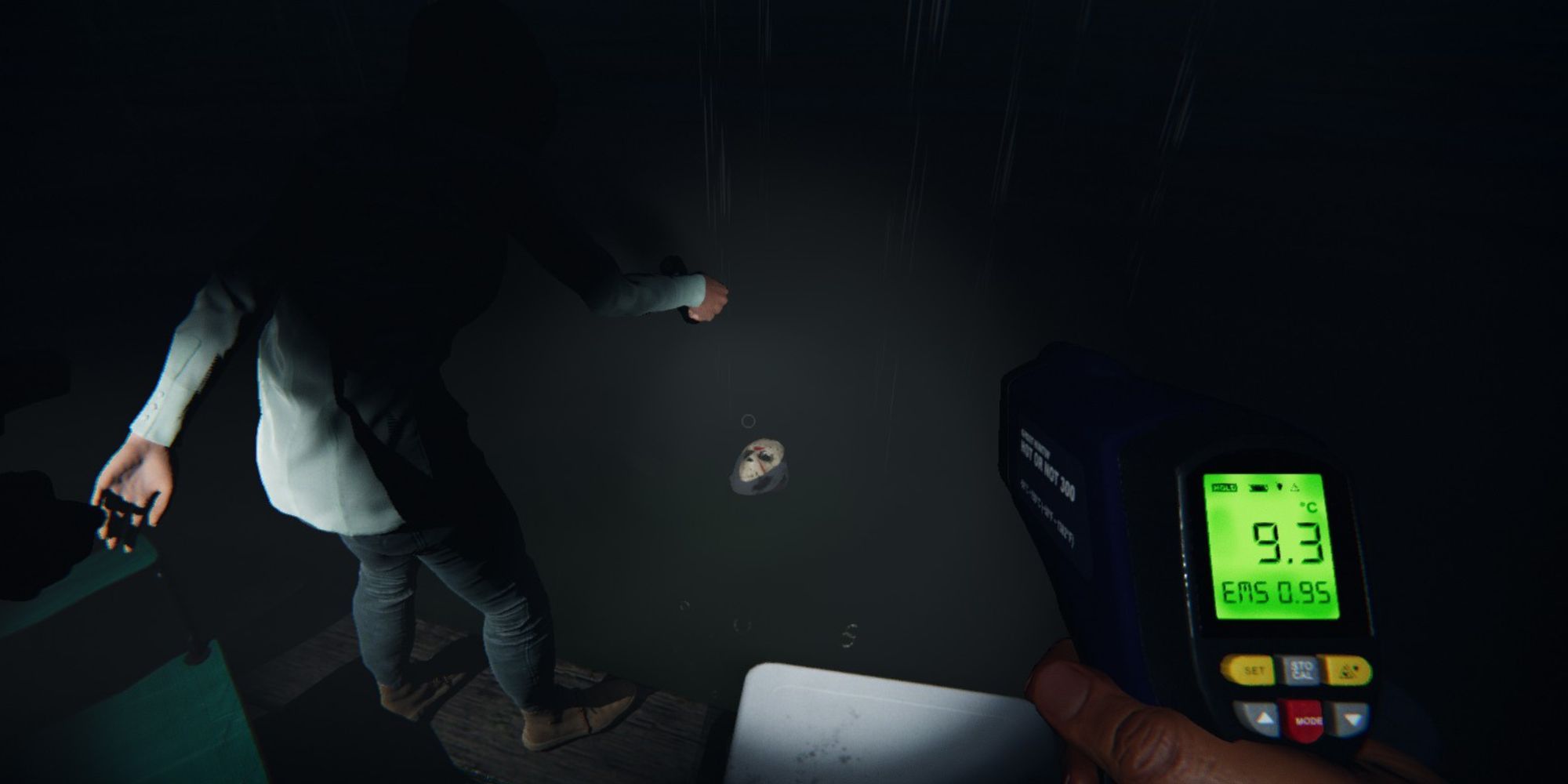 jason's mask floats up the water in the campsite