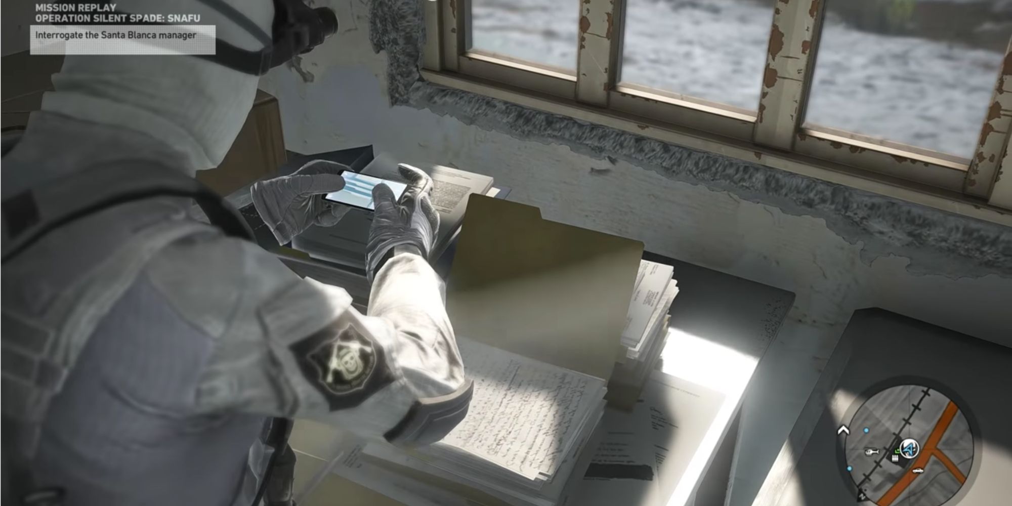 Soldier taking pictures of intel in Ghost Recon Wildlands