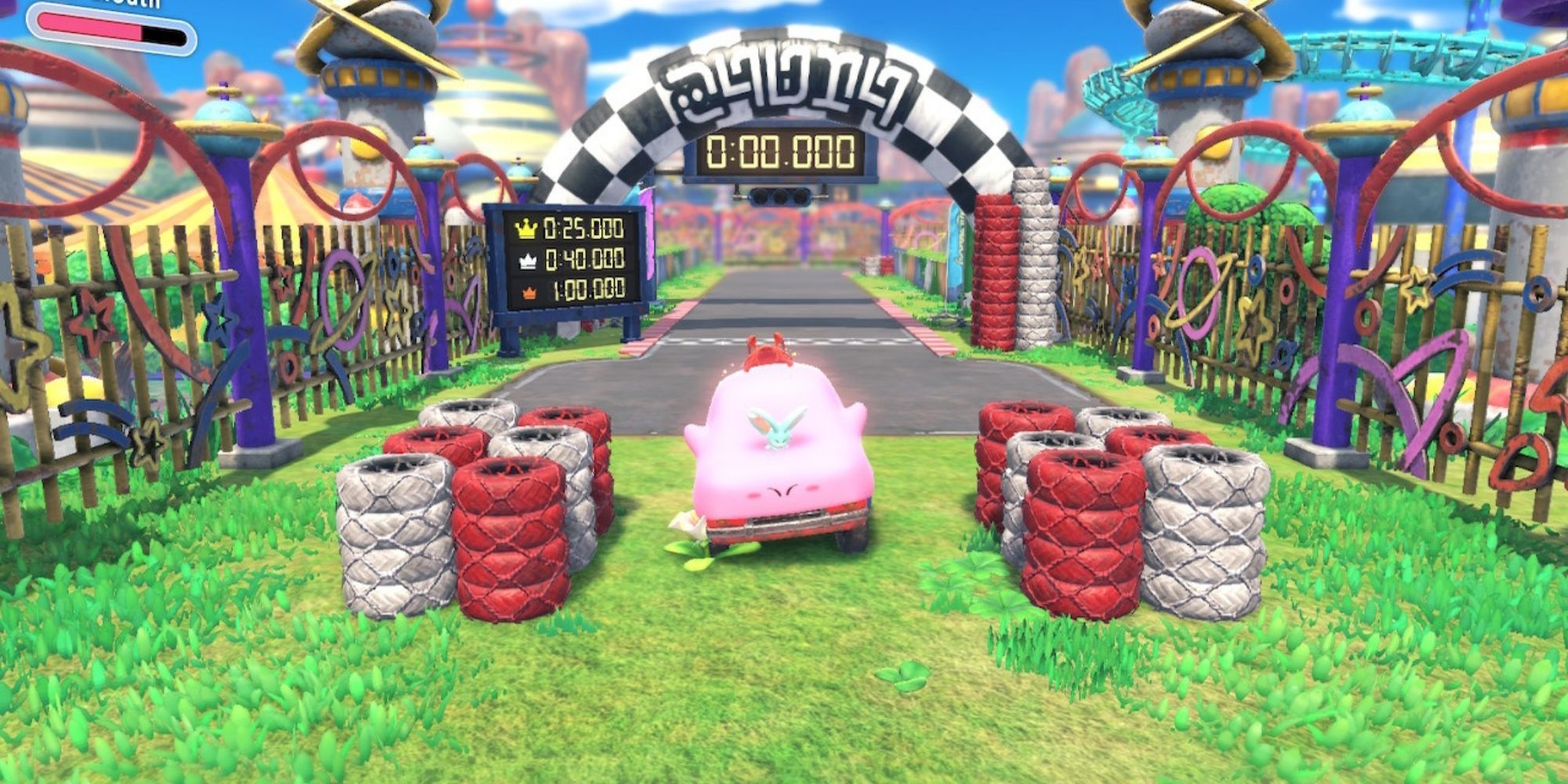 Car Kirby and Elfilin pose on front of a race track in Kirby and the Forgotten Land.