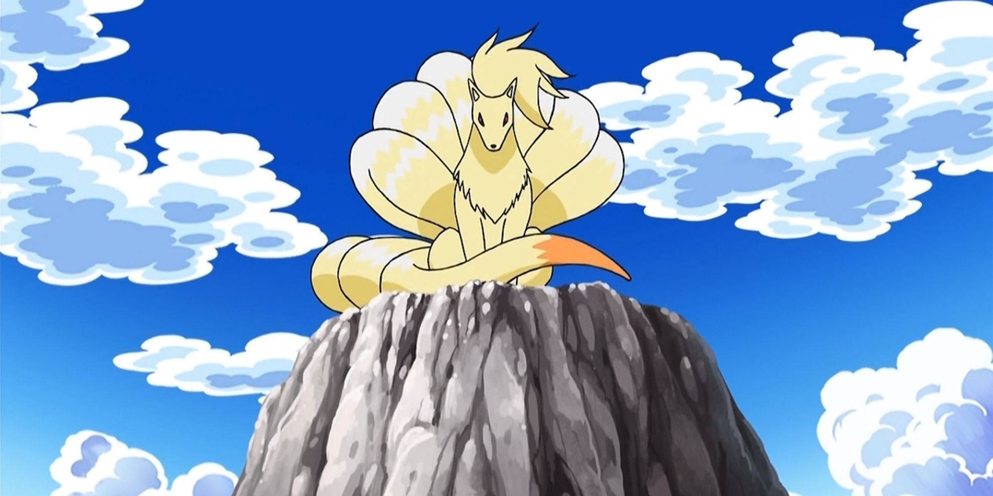Ninetails sits on a rock 