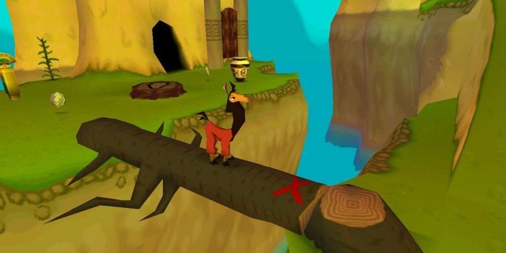 Kuzco crosses a fallen log