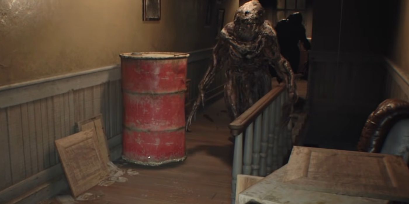 A monster standing next to a red barrel and a staircase