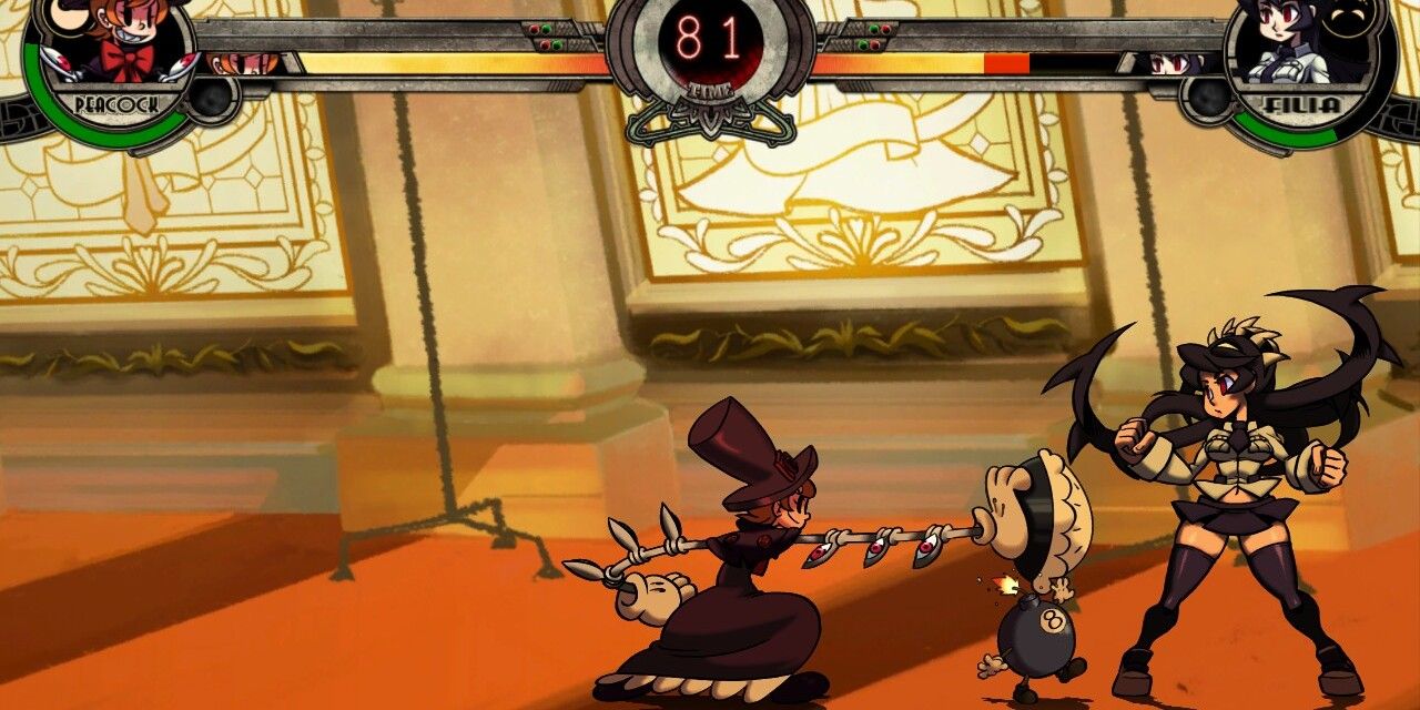 Skullgirls screenshot of Peacock and Filia fighting, with Peacock tossing a pie toward Filia as a tiny bomb walks her way