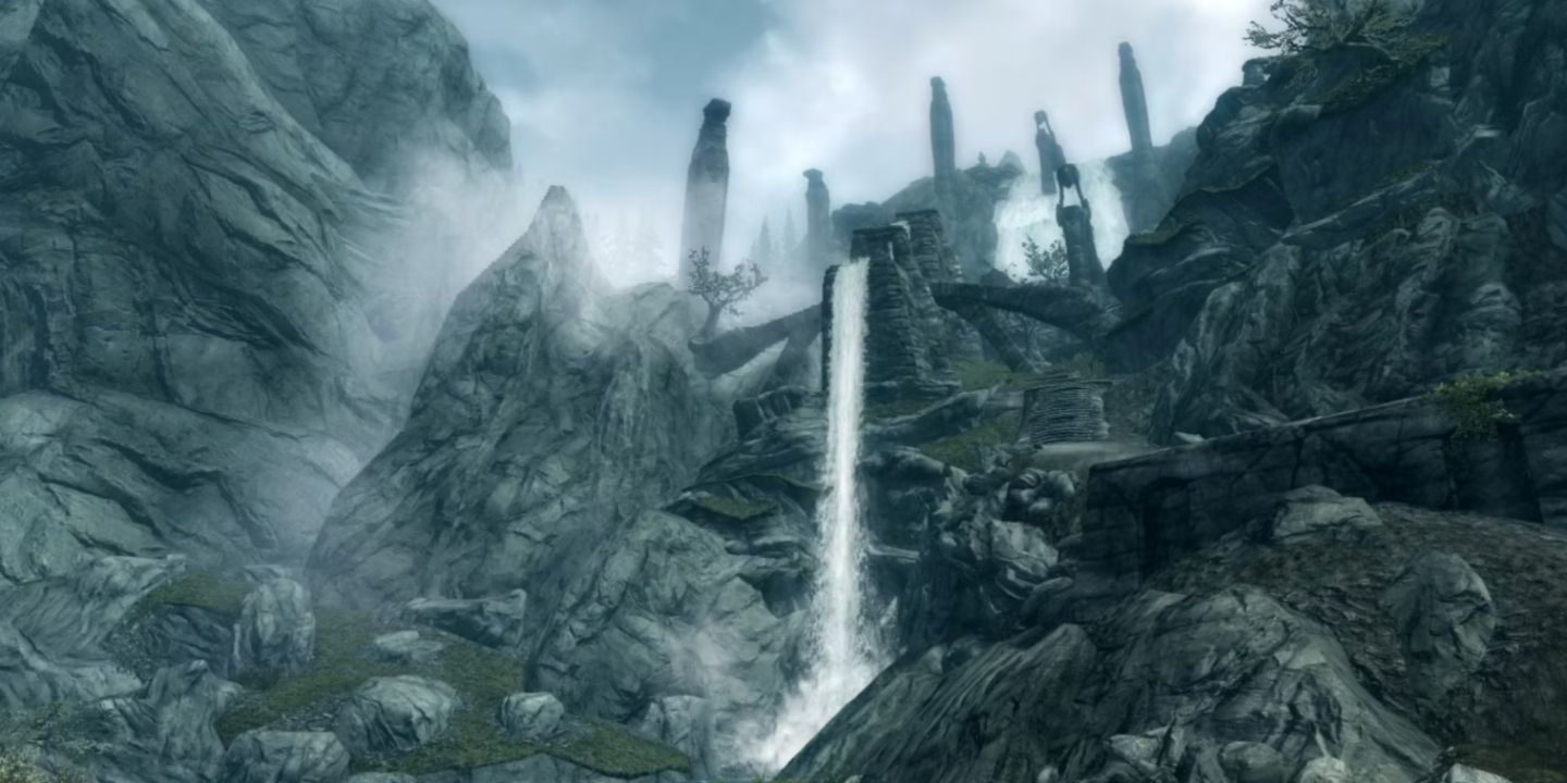 Wide shot showing the waterfall of Bard's Leap Summit in Skyrim