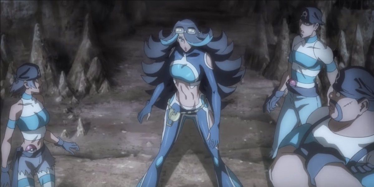 An aqua admin and three grunts standing in a cave
