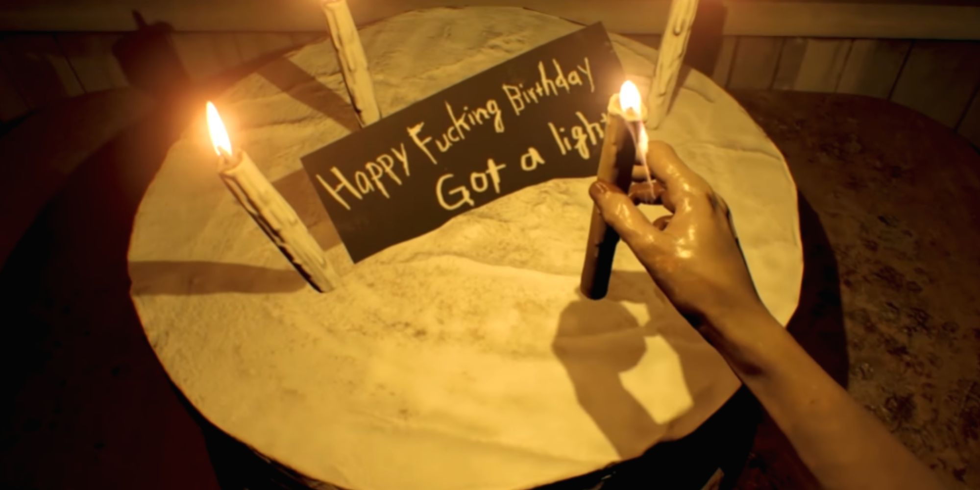 Resident Evil 7 putting a candle on a cake.