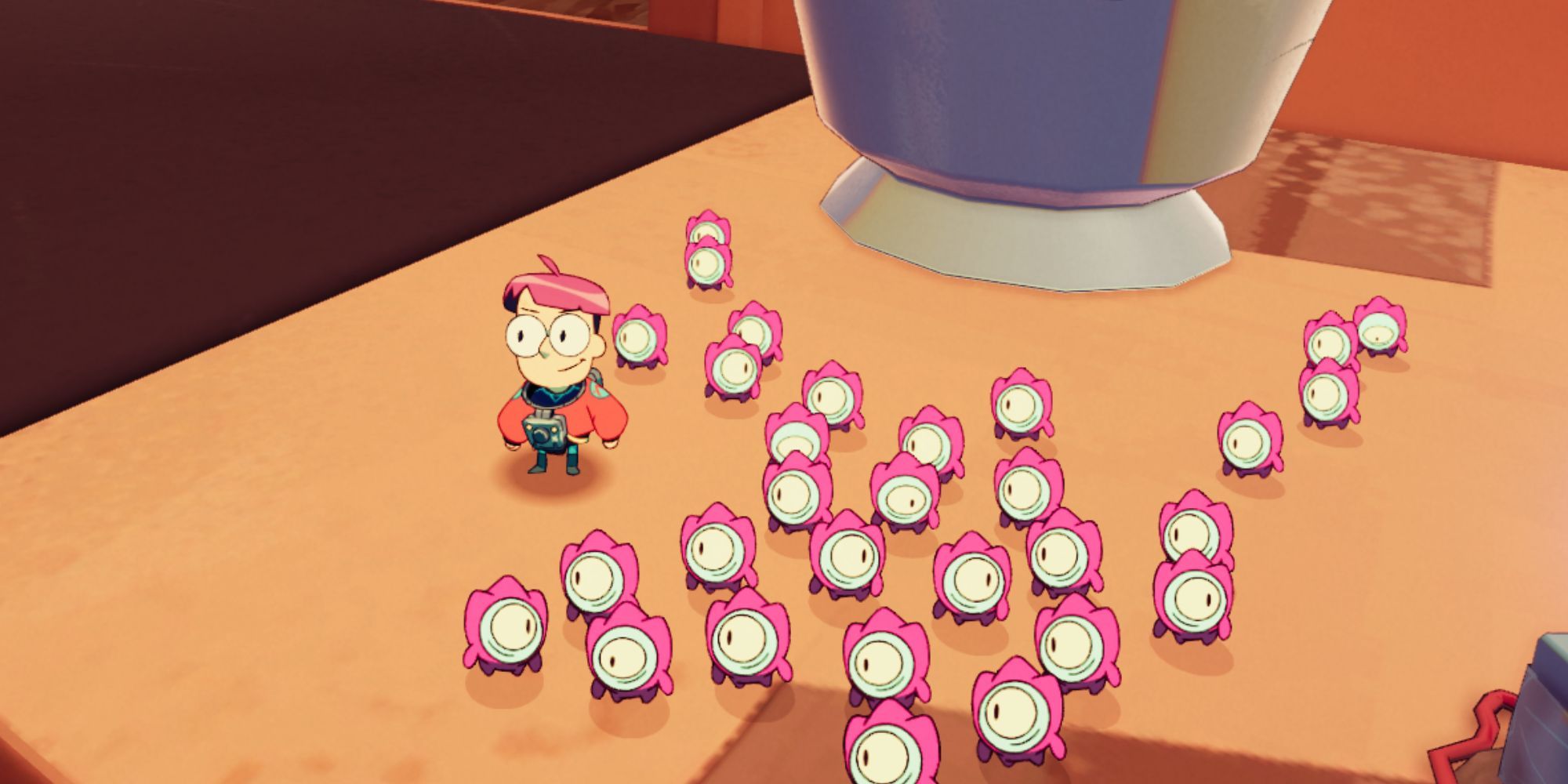 Milo standing next to pink tinykin.