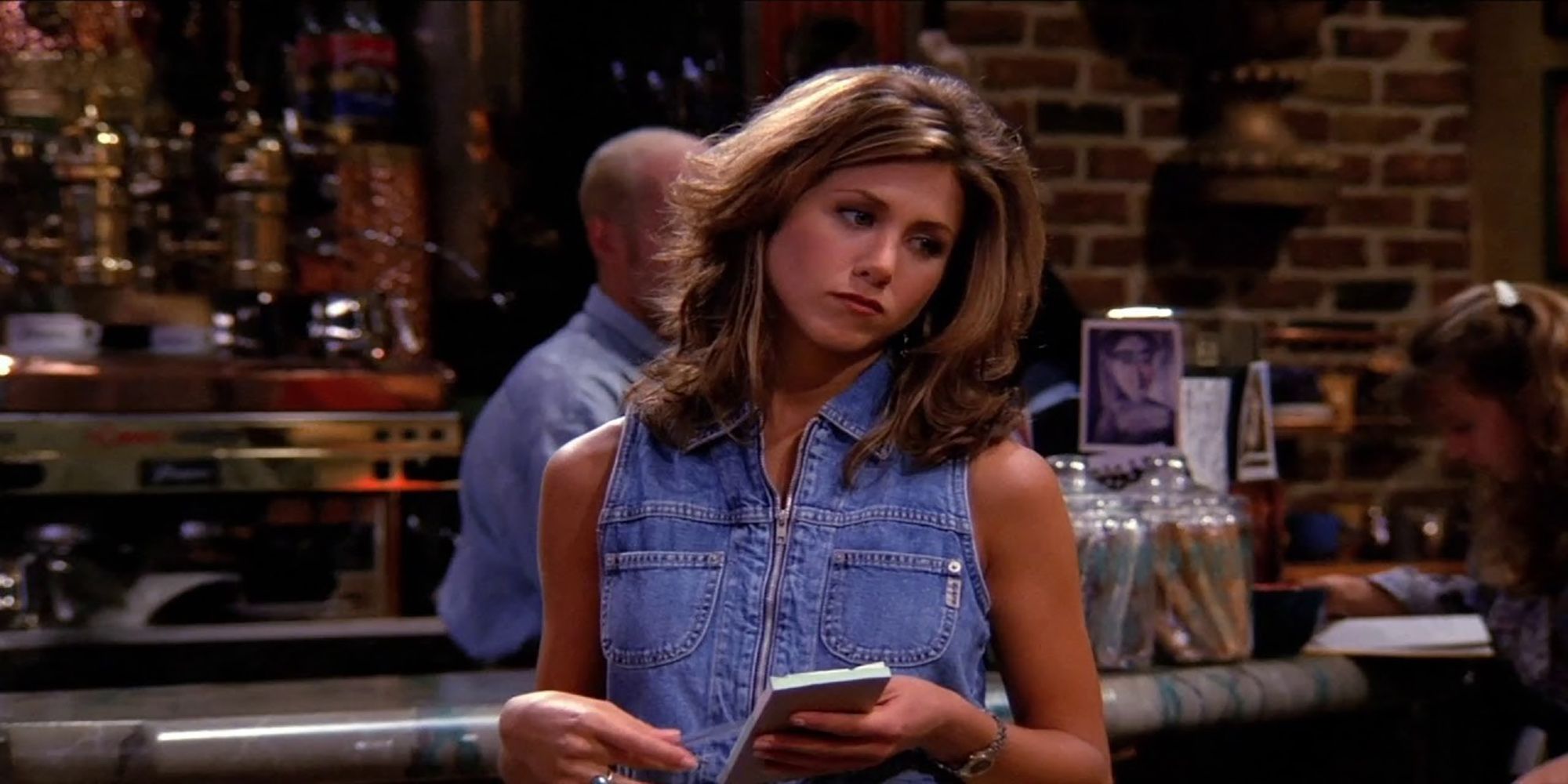 Rachel Green takes an order while working at Central Perk in Friends.