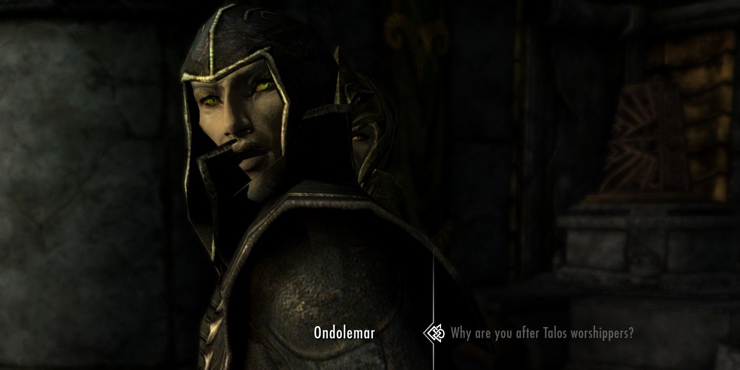 skyrim screenshot of a conversation with ondolemar, with a Thalmor soldier staring at the player over his shoulder.