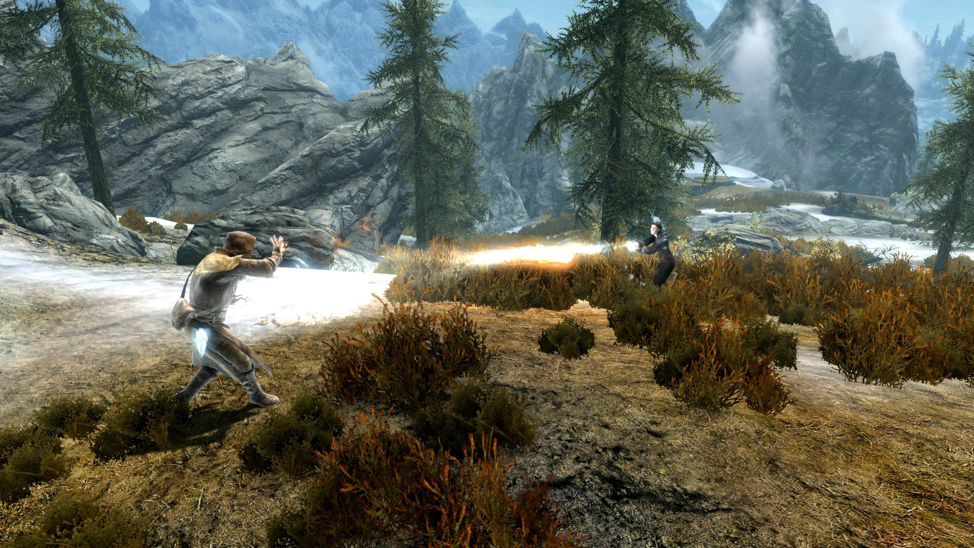 A pair of mages fight amongst craggy rocks as they duel in the mountains