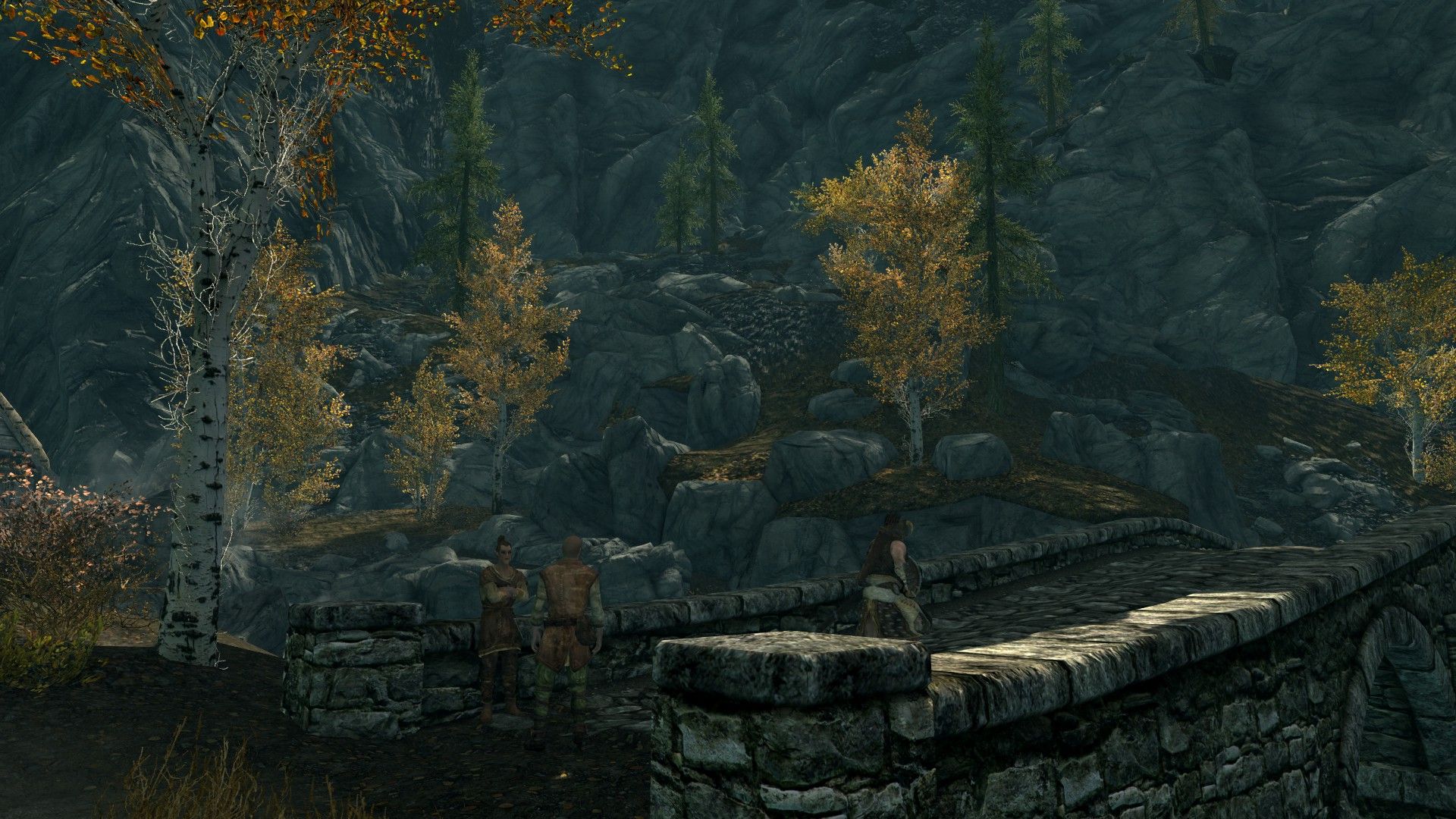A man walks past a pair of villagers in an aspen forest