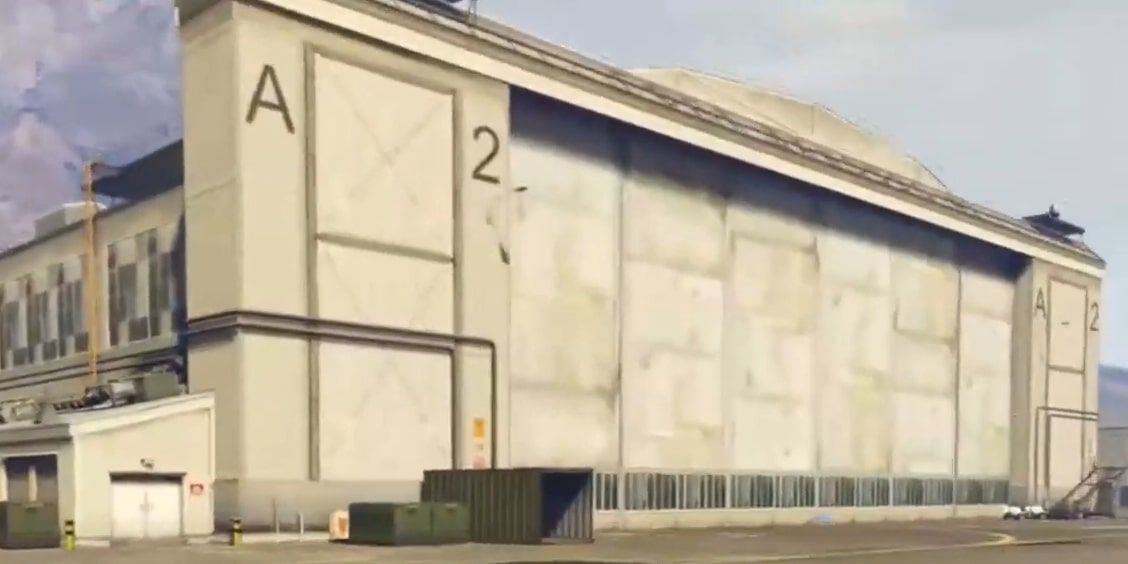 Screenshot of the exterior of Fort Zancudo Hangar A2 in GTA 5 Online.