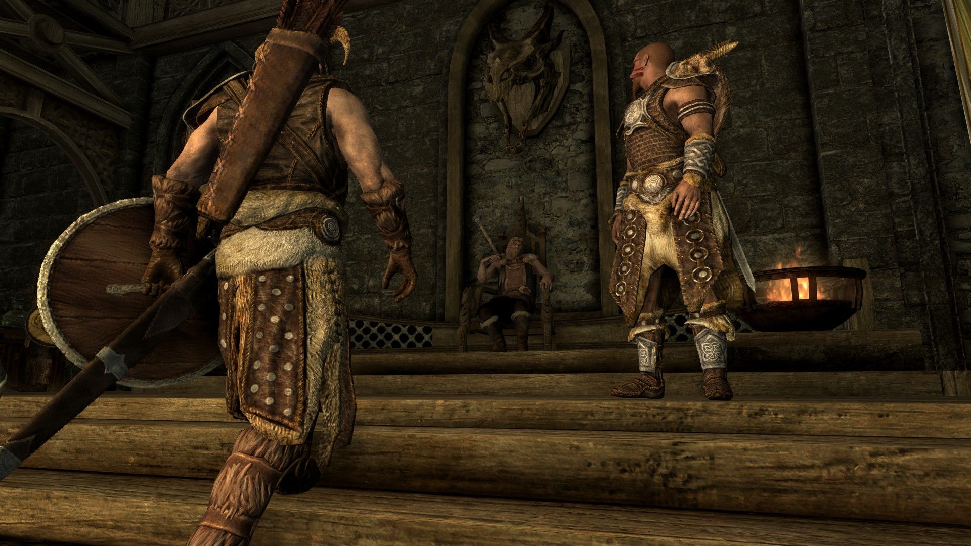 An adventurer approaches a local lord at his throne in a stone castle.