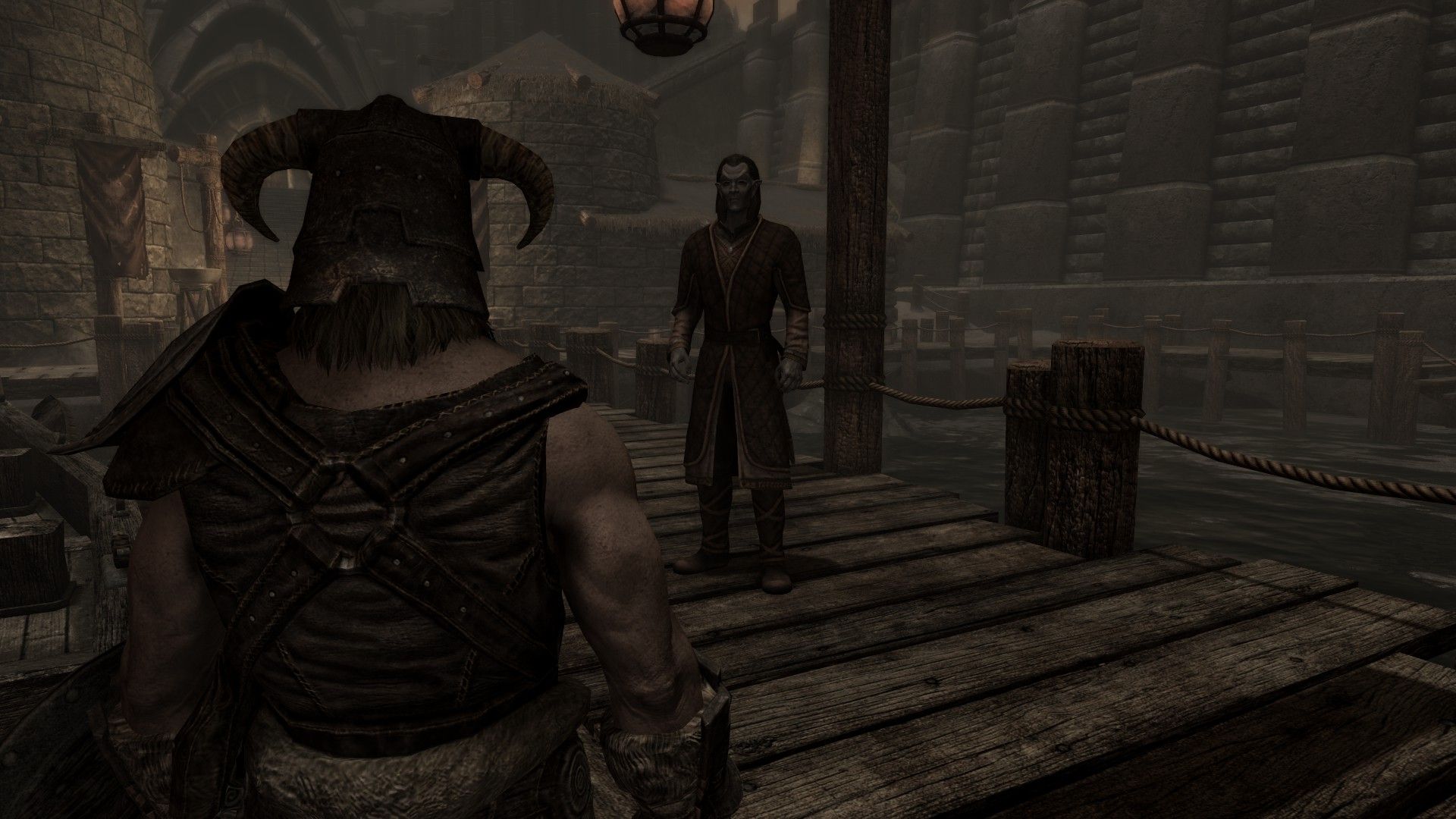 An official speaks to an adventurer at a dock on an overcast, gloomy day.