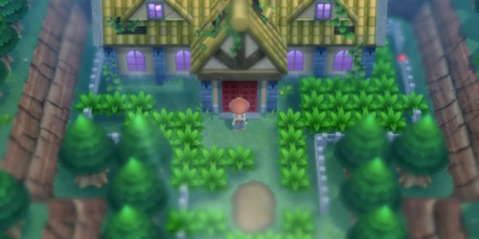 A Pokemon Trainer stands in front of the Old Chateau