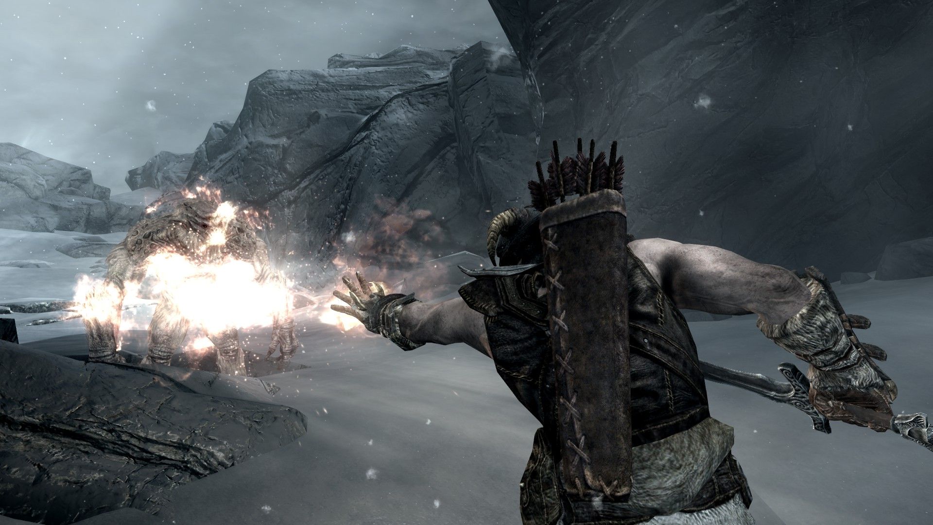 A man sprays fire at an approaching troll