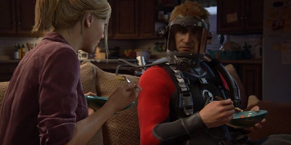 Nathan Drake having dinner with Elena while wearing his dive suit in Uncharted 4: A Thief's End 