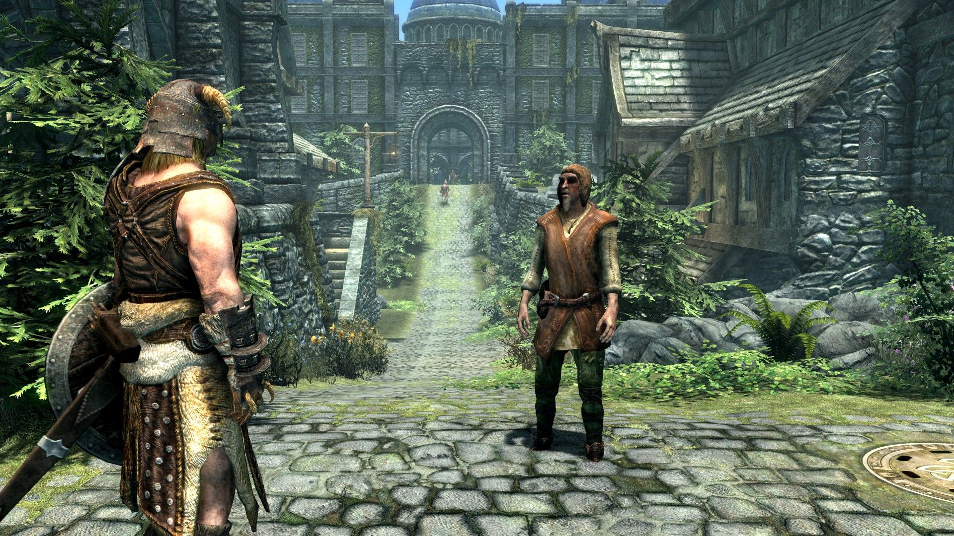 Two men speak on a cobbled street with a grand palace rising in the background.