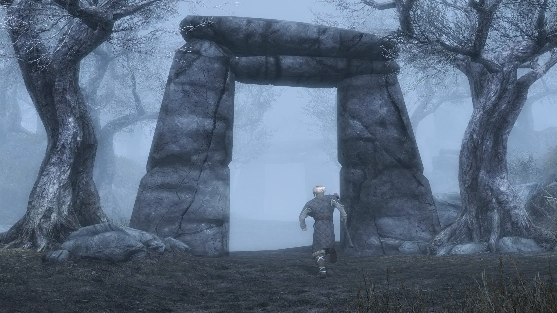A man dressed in fine clothes sprints through a tall arch in a misty forest.