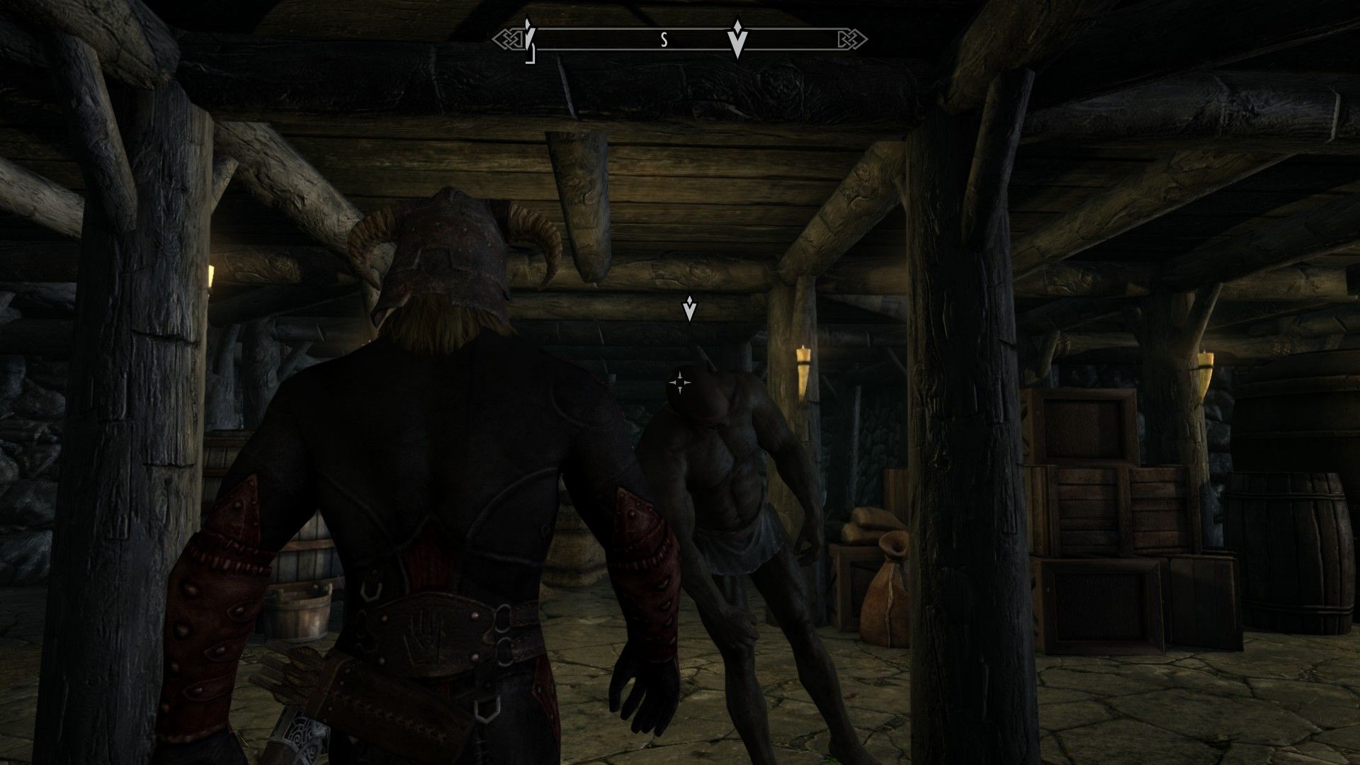 An assassin lifts the body of his target as he prepares to conceal the body.