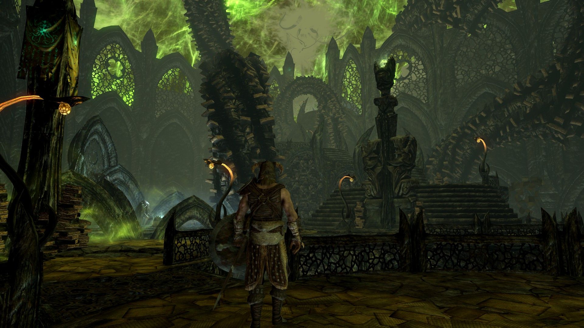 A man walks into a reality where towers of books stretch up into an alien, green sky