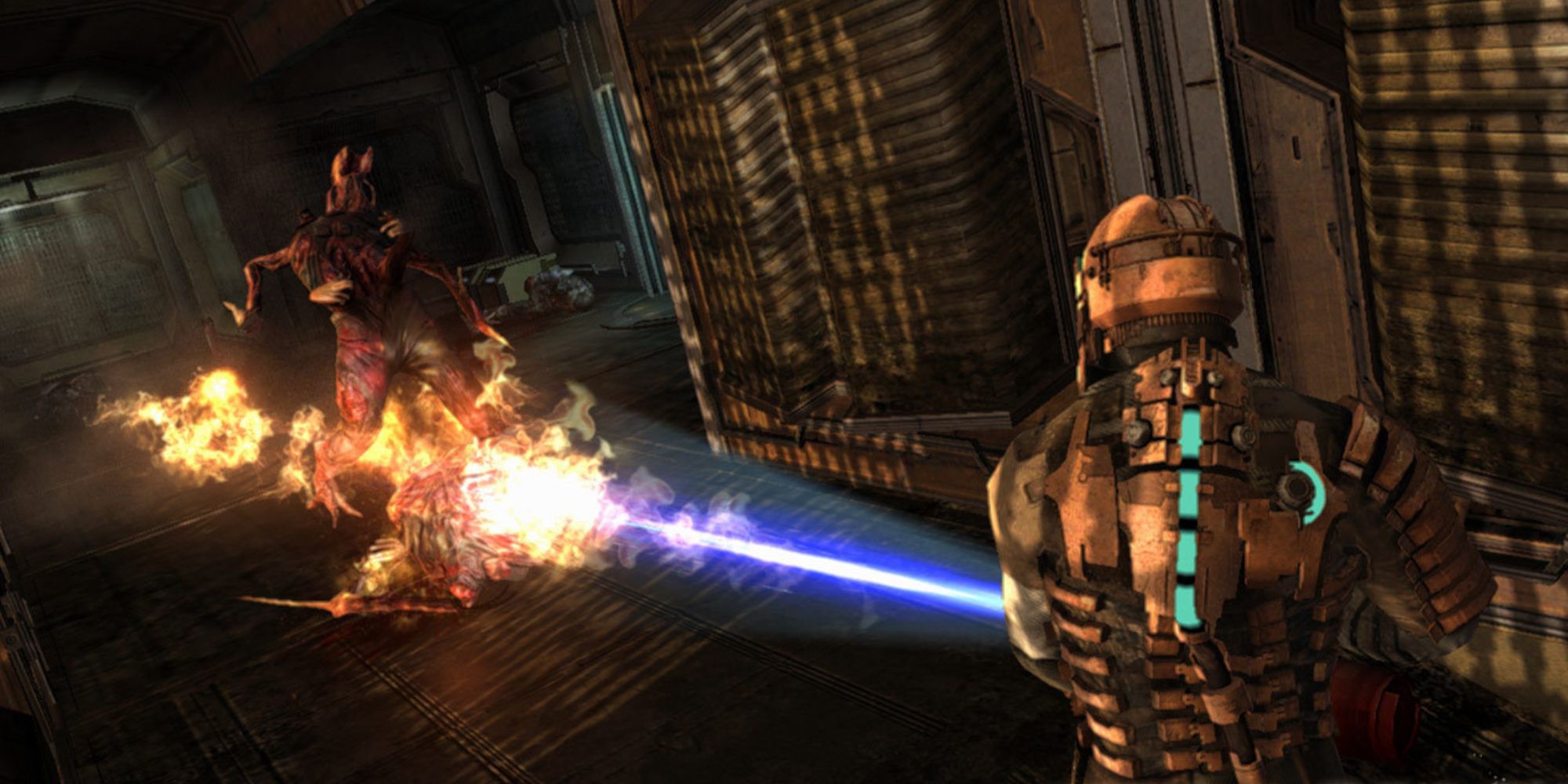 Isaac Clarke burning a Necromorph in Dead Space