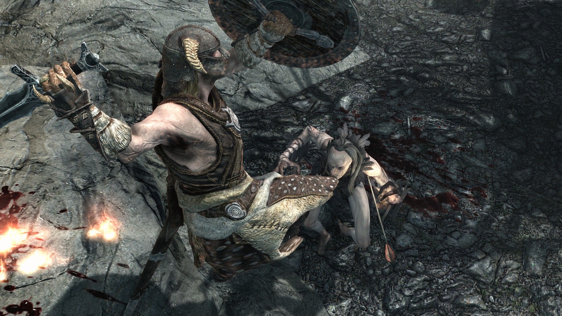 A man leaps through the air, trailing fire, as he strikes down at a mutated and misshapen woman.