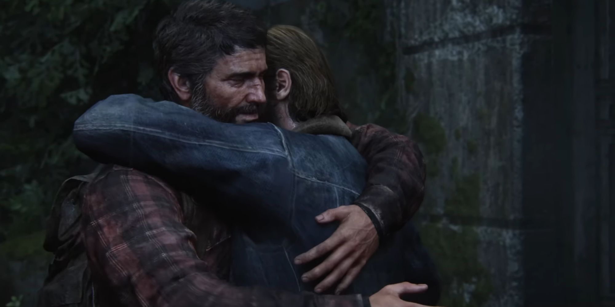 Joel and Tommy hug outside by a brick wall and some trees