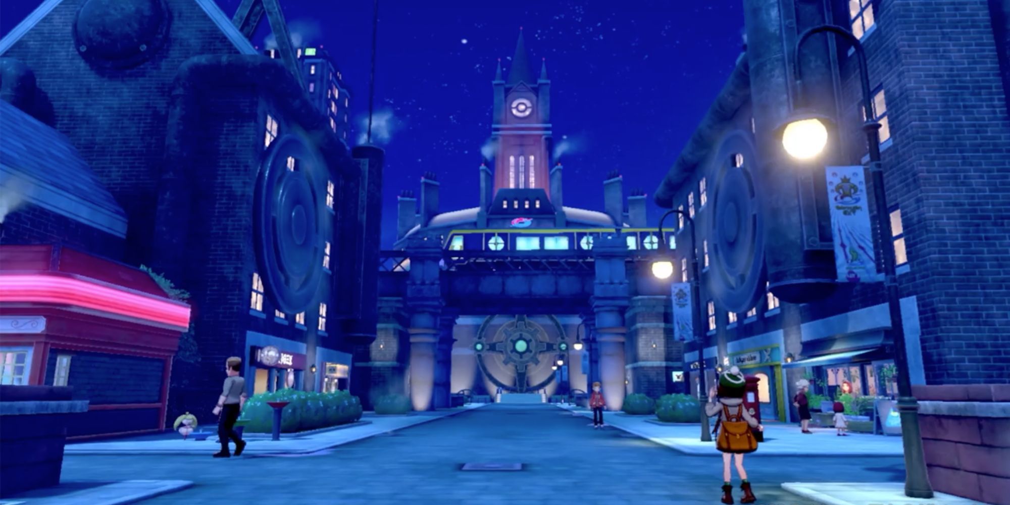 Pokemon Trainers stand in Motostoke City at night