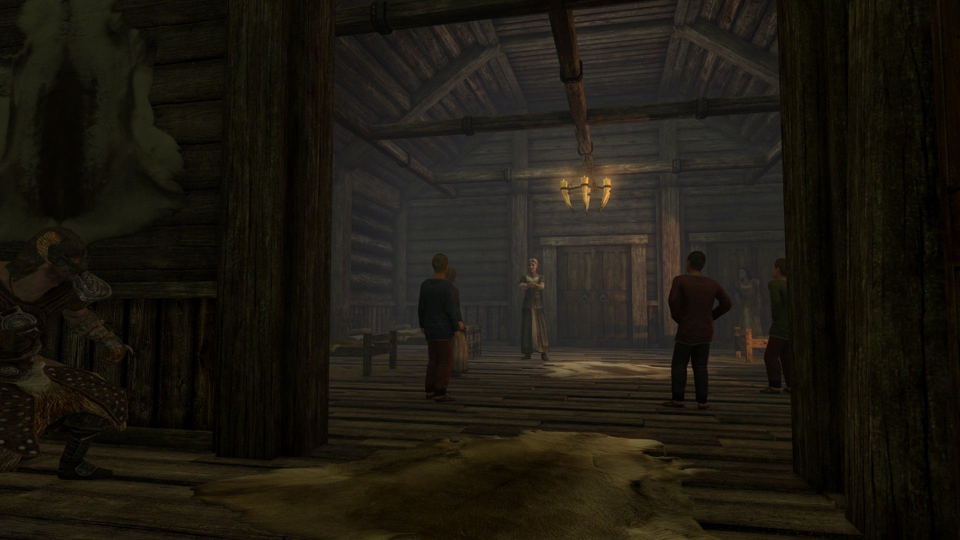 A man peeks around a corner as a woman berates children in her orphanage.
