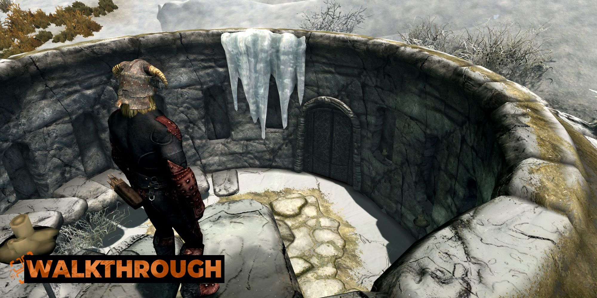 A man peers down at an ancient tomb in a snowy tundra. 