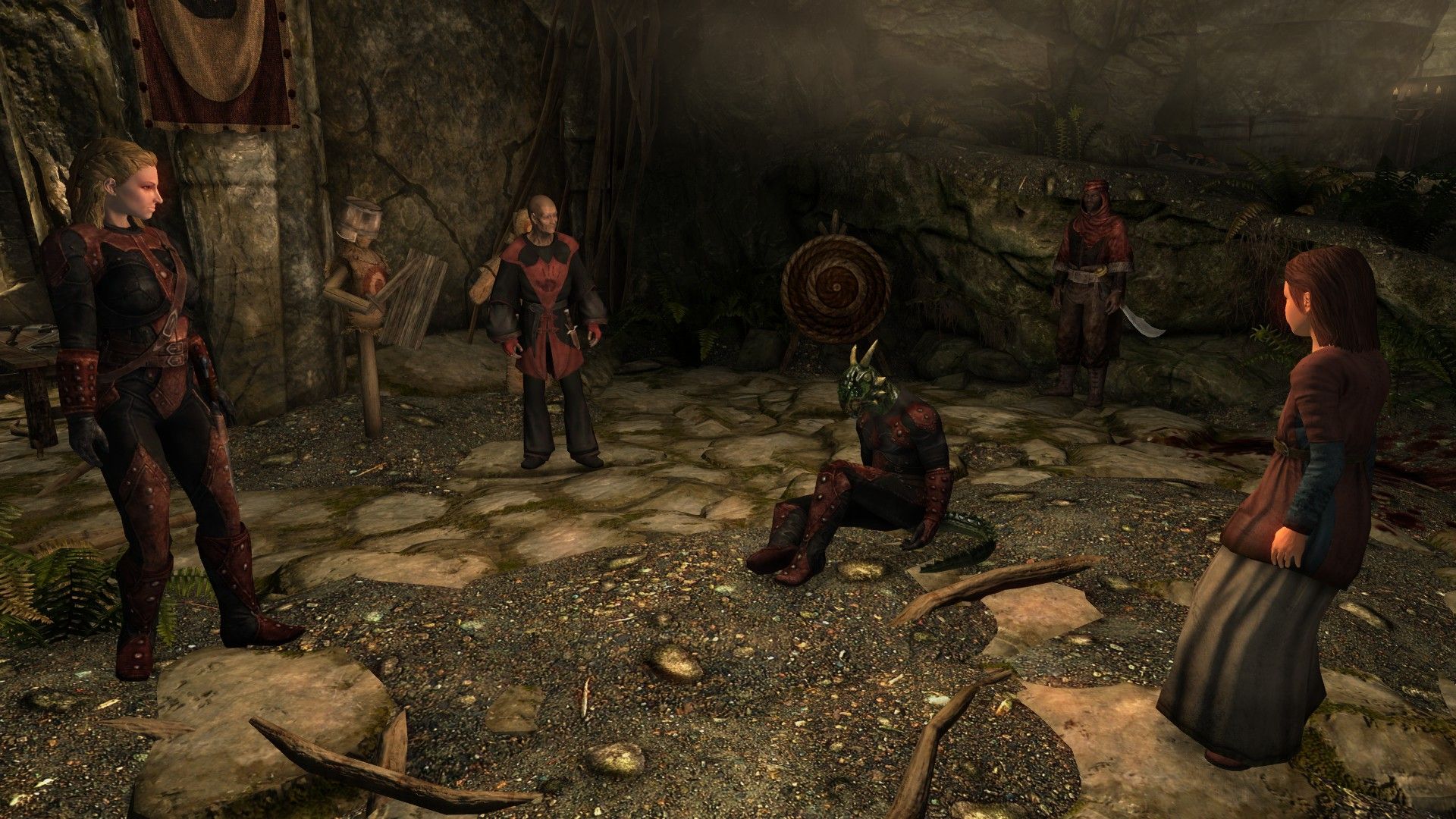 An injured argonian lays on the ground, surrounded by friends inside an assassin's sanctuary.