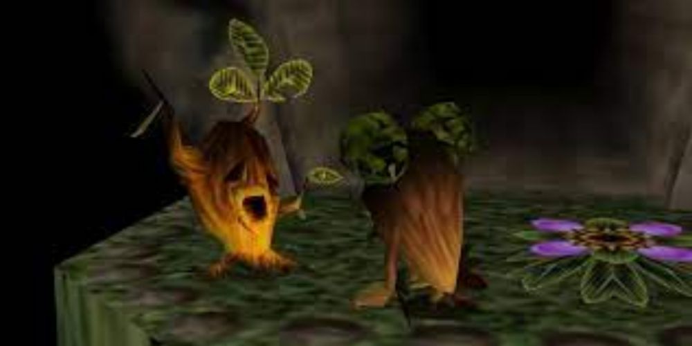 The Deku Butler on his knees looking at his son in Majora's Mask.