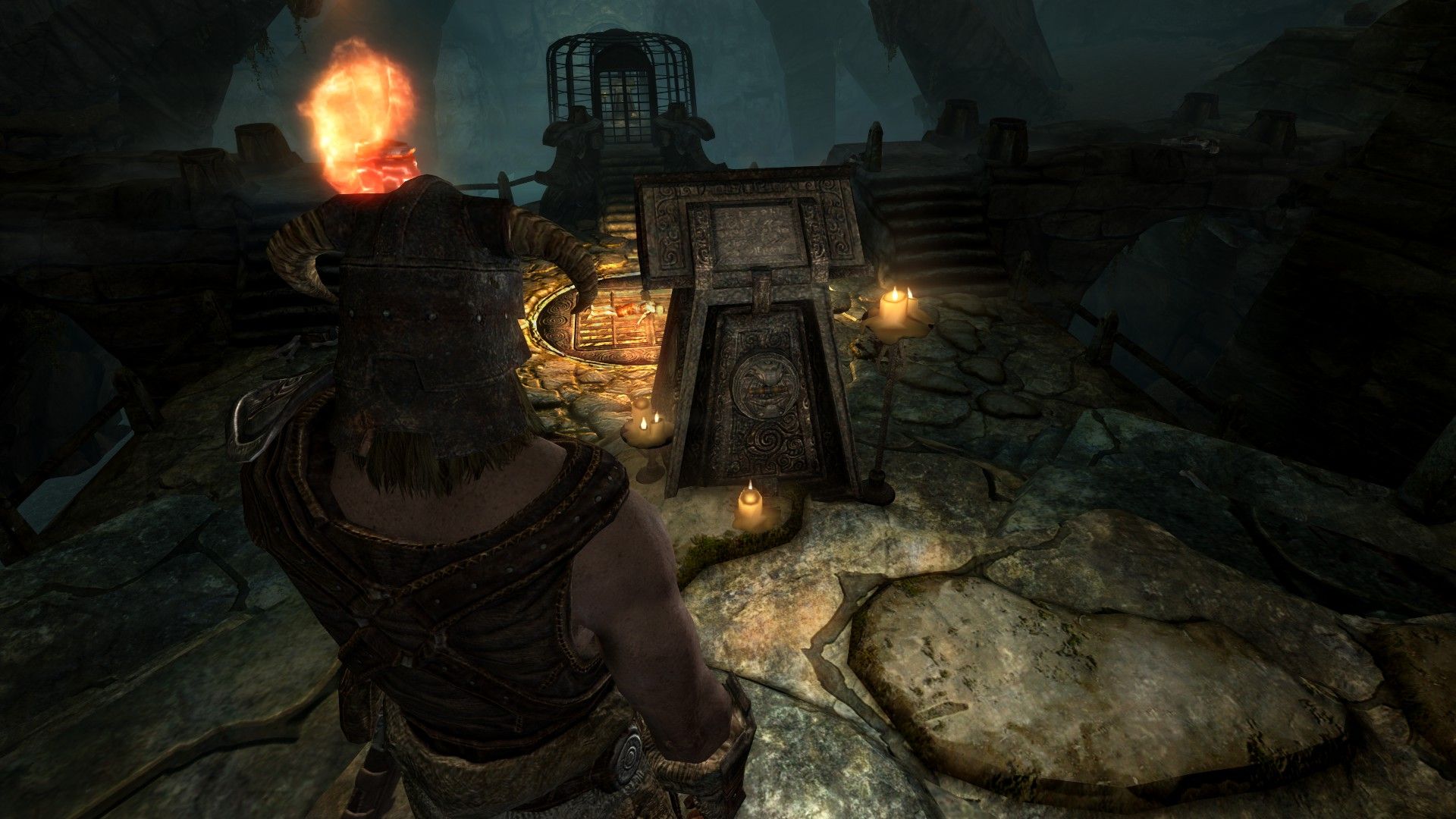 An adventurer looks at a handle as a roaring pit of fire illuminates a lower chamber in orange light.