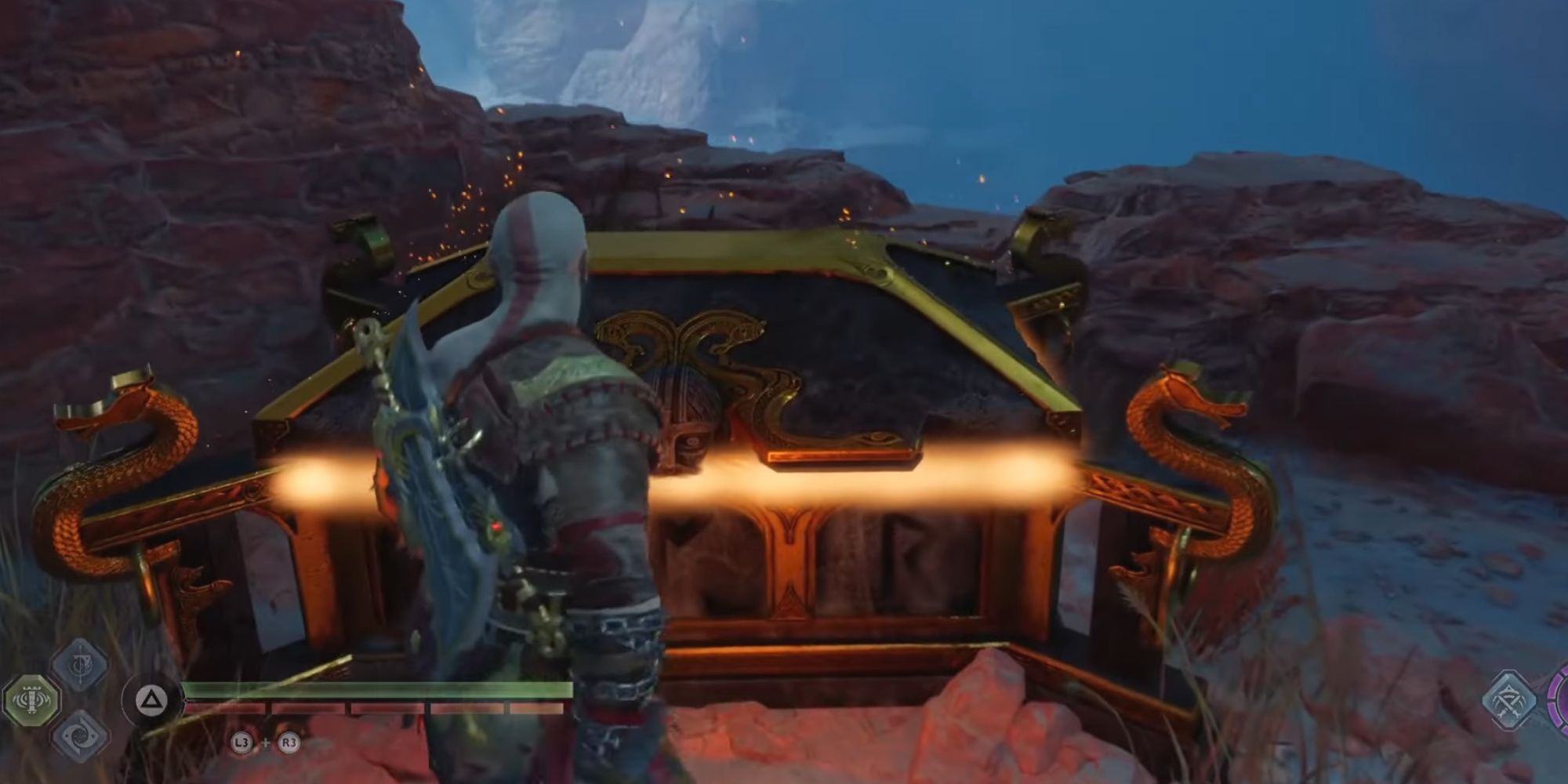 Kratos opening a Nornir chest after breaking the three seals. 