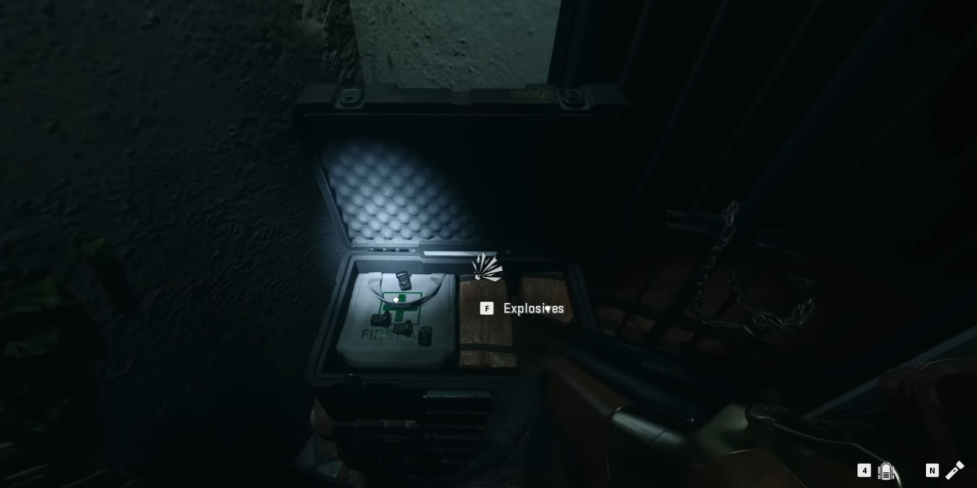 Opening a supplies box with explosives you can pick up. Your character is holding a shotgun.