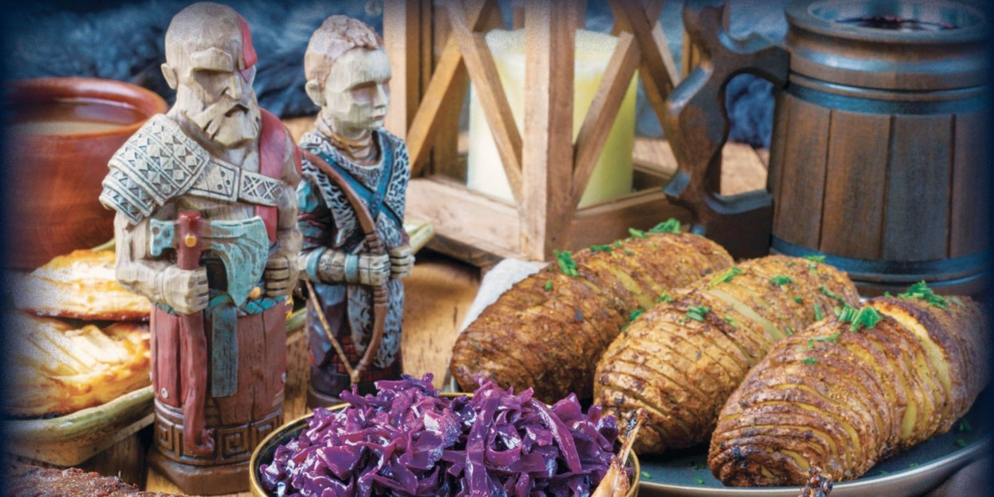 karatos and atreus figures stood on a table of food