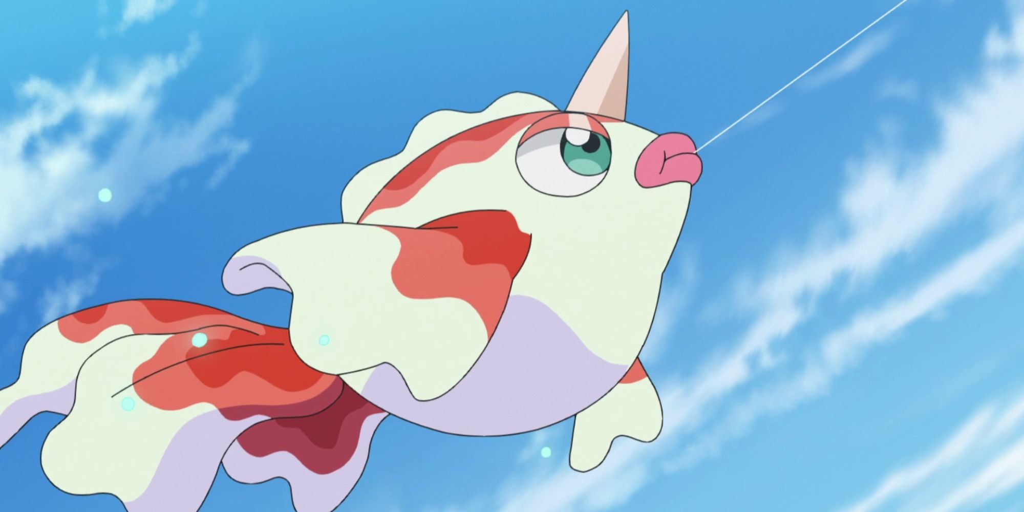 Goldeen jumps through the air with water dripping from it