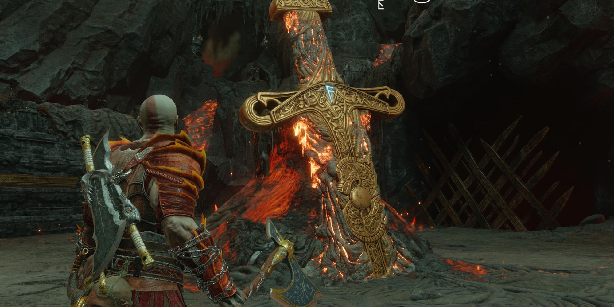 Kratos holding his axe and standing next to a buried fiery sword in Muspelheim.